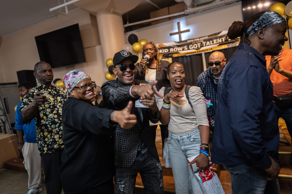 Winners, judges and volunteers celebrate after the winners are announced at the end of Skid Row's inaugural talent show in downtown Los Angeles, Saturday, Sept. 19, 2026. (AP Photo/Jae C. Hong)