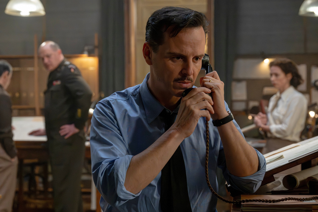 This image released by Focus Features shows Brendan Fraser, background left, Andrew Scott, center, and Kerry Condon in a scene from "Pressure." (Focus Features via AP)