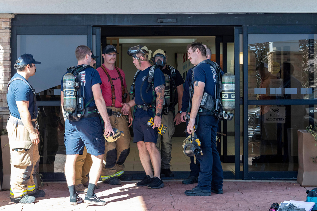 First responders check the Holiday Inn Express in Weatherford, Okla. on Thursday, Nov. 13, 2025 where an ammonia gas leak in the parking lot the previous night warranted evacuation. (AP Photo/Alonzo Adams)