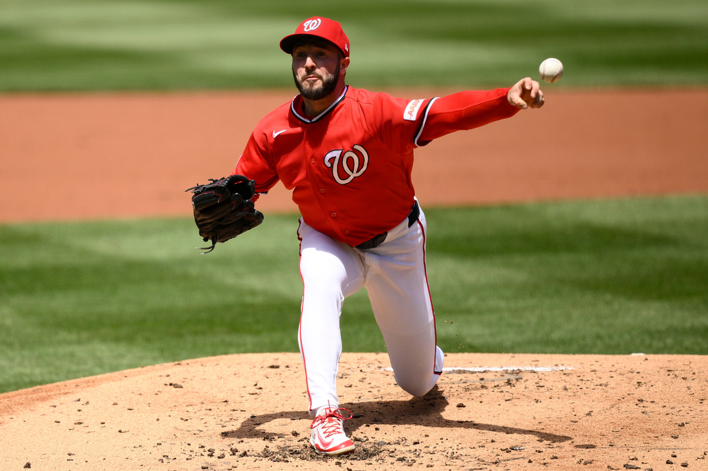 Washington Nationals pitcher PJ Poulin throws during the second inning of a baseball game against the Milwaukee Brewers, Sunday, May 3, 2026, in Washington. (AP Photo/Nick Wass)