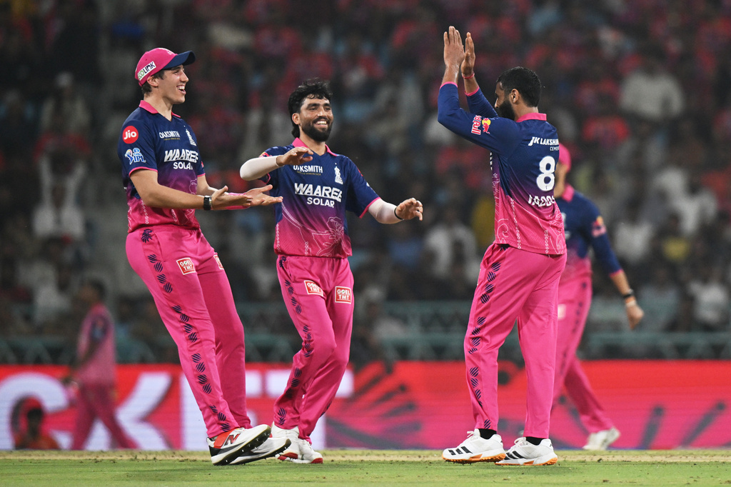 Rajasthan Royals' Ravindra Jadeja, right, celebrates with teammates the wicket of Lucknow Super Giants' Nicholas Pooran during the Indian Premier League cricket match between Lucknow Super Giants and Rajasthan Royals in Lucknow, India, Wednesday, April 22, 2026. (AP Photo)