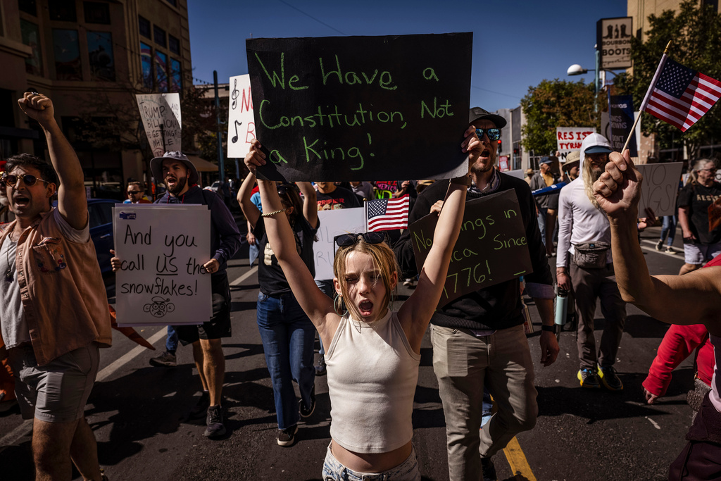 Daniella Diener participates with other protesters in the "No Kings" rally and march in downtown Albuquerque, N.M., on Saturday, Oct. 18, 2025. (Chancey Bush/The Albuquerque Journal via AP)