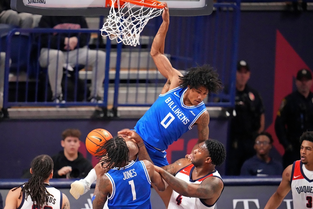 Saint Louis guard Kellen Thames (0) dunks a shot during the first half of the team's NCAA college basketball game against Duquesne in Pittsburgh, Tuesday, Jan. 20, 2026. (AP Photo/Gene J. Puskar)