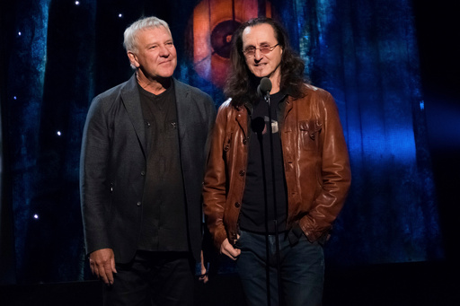FILE - Alex Lifeson, left, and Geddy Lee from the band Rush appear at the 2017 Rock and Roll Hall of Fame induction ceremony on April 7, 2017, in New York. (Photo by Charles Sykes/Invision/AP, File) FILE - Alex Lifeson, left, and Geddy Lee from the band Rush appear at the 2017 Rock and Roll Hall of Fame induction ceremony on April 7, 2017, in New York. (Photo by Charles Sykes/Invision/AP, File)