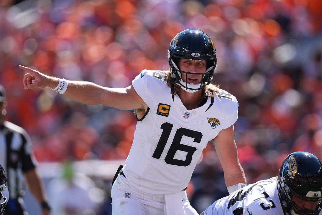 Jacksonville Jaguars quarterback Trevor Lawrence calls a play in the first half of an NFL football game between the Jaguars and the Denver Broncos in Denver, Sunday, Sept. 20, 2026. (AP Photo/David Zalubowski)