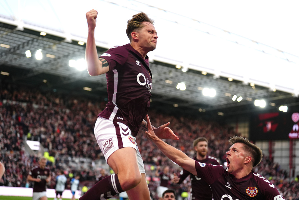 Heart of Midlothian's Frankie Kent, left, celebrates scoring their first goal of the game during the Scottish Premiership soccer match between Heart of Midlothian and Falkirk, Wednesday, May 13, 2026, in Edinburgh, Scotland. (Andrew Milligan/PA via AP)