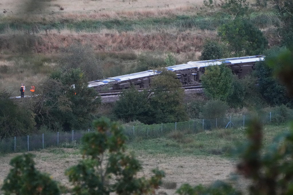 A train with around 150 people aboard derailed near the Lewes, England, railway station in East Sussex on Thursday, Aug. 13, 2026. (Jonathan Brady/PA via AP)