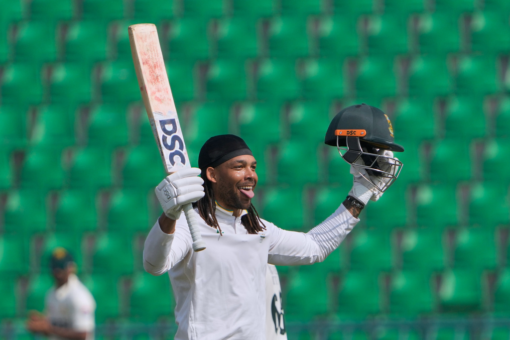 South Africa's Tony dy Zorzi celebrates after scoring century during the third day of the first test cricket match between Pakistan and South Africa, in Lahore, Pakistan, Tuesday, Oct. 14, 2025. (AP Photo/K.M. Chaudary)