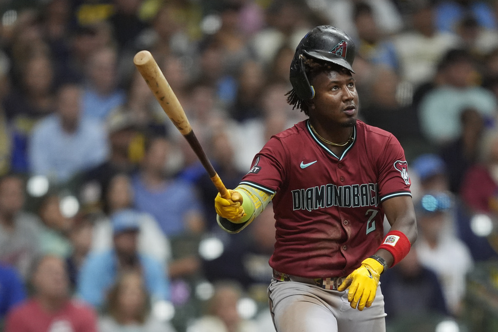 Arizona Diamondbacks' Geraldo Perdomo watches after hitting a solo home run during the eighth inning of a baseball game against the Milwaukee Brewers, Wednesday, Aug. 27, 2025, in Milwaukee. (AP Photo/Aaron Gash)