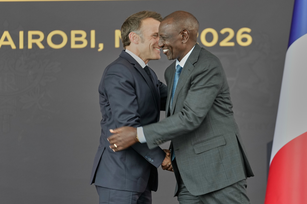 France's President Emmanuel Macron, left, and Kenya's President William Ruto greet each other at State House in Nairobi, Sunday, May 10, 2026. (AP Photo/Brian Inganga)
