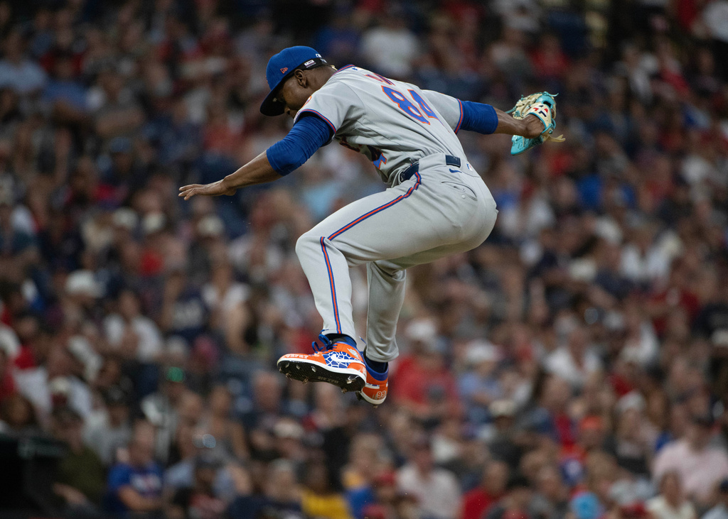 After striking out Cleveland Guardians' Angel Martinez during his Major League debut, New York Mets relief pitcher Jefry Yan reacts during the sixth inning of a baseball game, Wednesday, Aug. 5, 2026, in Cleveland. (AP Photo/Phil Long)