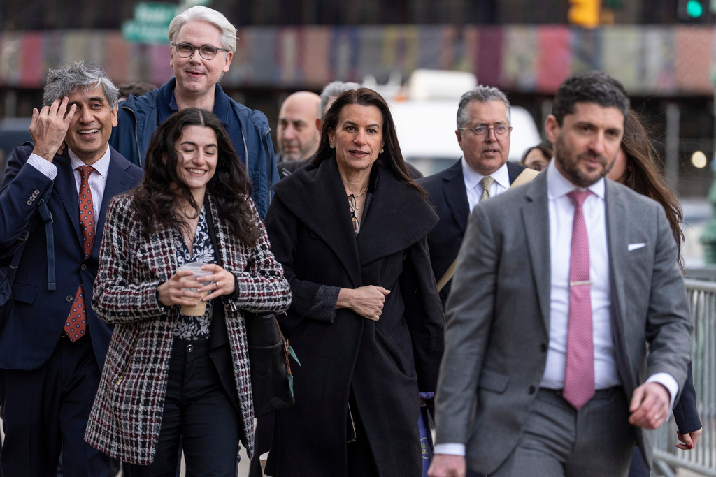 Legal team of Luigi Mangione including Karen Friedman Agnifilo, center, and Marc Agnifilo, second right, arrive at Manhattan federal court, Friday, Jan. 9, 2026, in New York. (AP Photo/Yuki Iwamura)