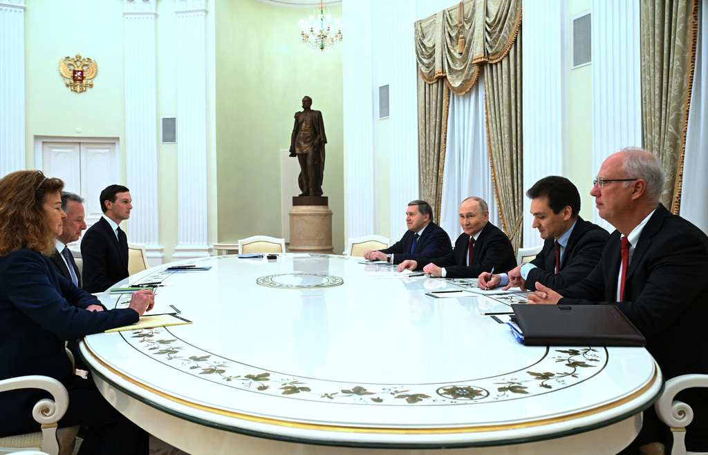 FILE - Russian President Vladimir Putin, third from right, Russian Presidential Foreign Policy Adviser Yuri Ushakov, fourth from right, and Russian Direct Investment Fund CEO Kirill Dmitriev, right, attend talks with U.S. special envoy Steve Witkoff, second from left, and Jared Kushner, U.S. President Donald Trump's son-in-law, third, at the Kremlin in Moscow, Russia, Dec. 2, 2025. (Kristina Kormilitsyna/Sputnik, Kremlin Pool Photo via AP, File)