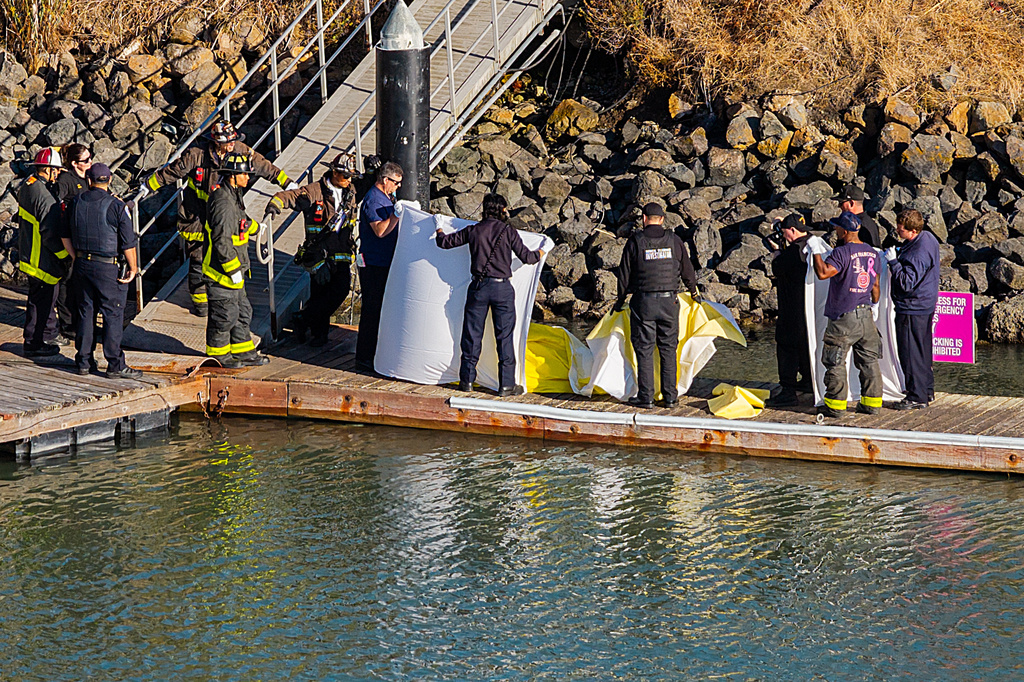 First responders prepare to move a body after a boat accident near Alcatraz Island off San Francisco, Tuesday, July 14, 2026. (AP Photo/Noah Berger)