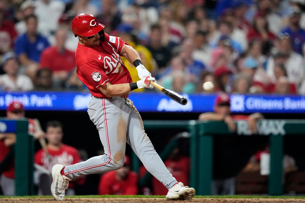 Cincinnati Reds' Spencer Steer hits a run-scoring double against Philadelphia Phillies pitcher José Alvarado during the eighth inning of a baseball game Monday, May 18, 2026, in Philadelphia. (AP Photo/Matt Slocum)