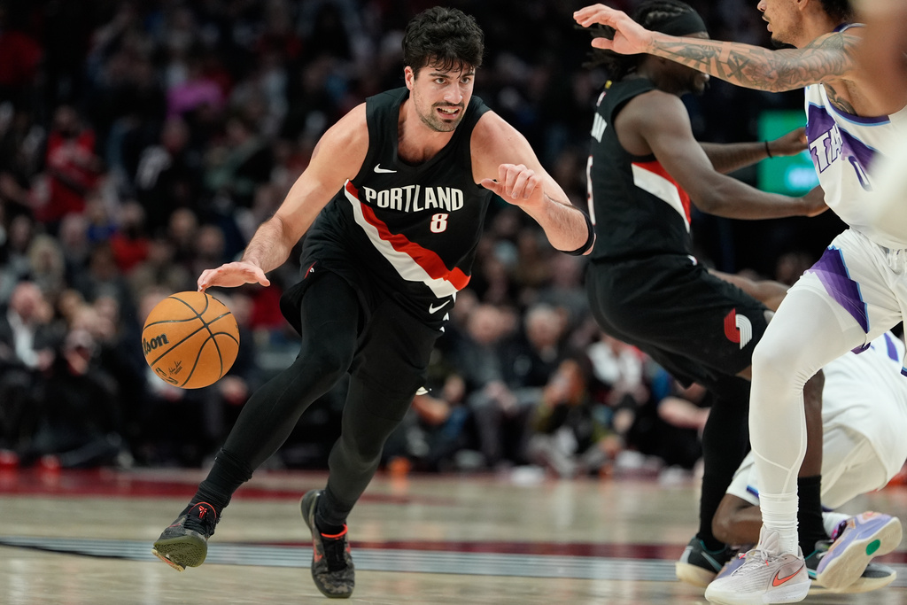 Portland Trail Blazers forward Deni Avdija (8) drives to the basket during the first half of an NBA basketball game against the Utah Jazz, Friday, March 13, 2026, in Portland, Ore. (AP Photo/Jenny Kane)