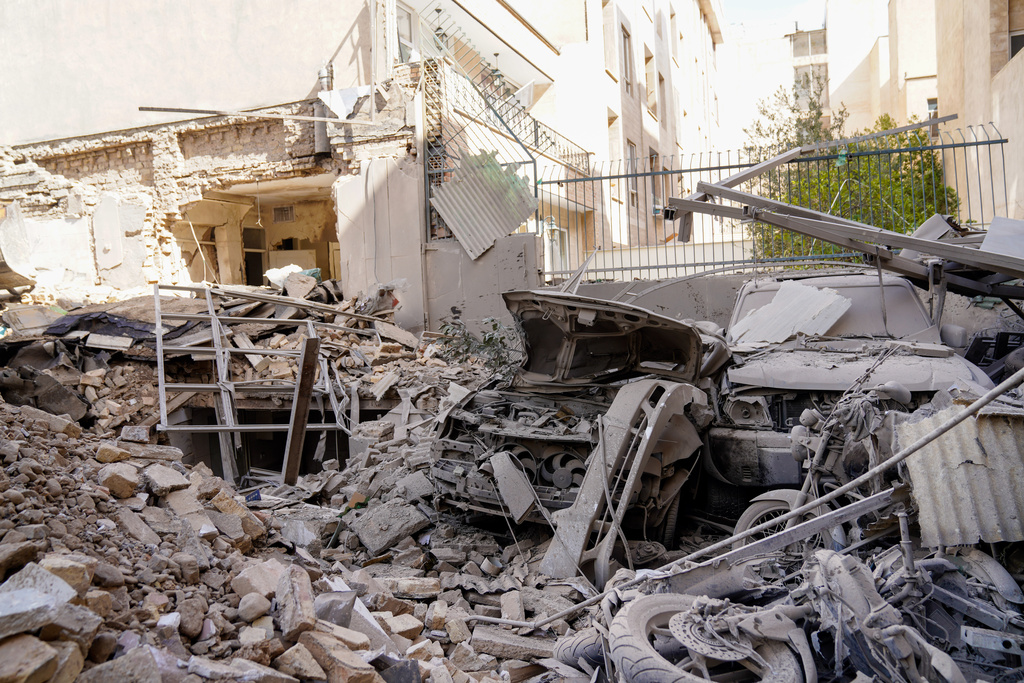 Rubble remains in the aftermath of an Israeli-U.S. strike in Tehran, Iran, Saturday, Feb. 28, 2026. (AP Photo/Amir Kholousi, ISNA)