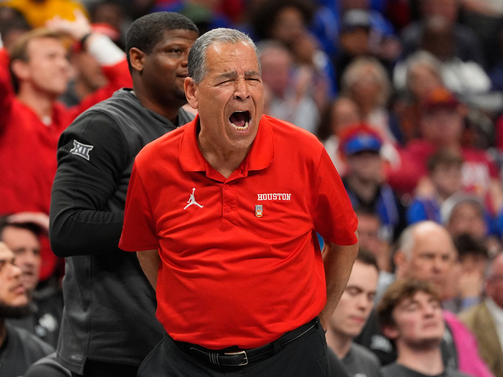 Houston head coach Kelvin Sampson is seen on the sidelines during the first half of an NCAA college basketball game against Kansas in the semifinal round of the Big 12 Conference tournament Friday, March 13, 2026, in Kansas City, Mo. (AP Photo/Charlie Riedel)