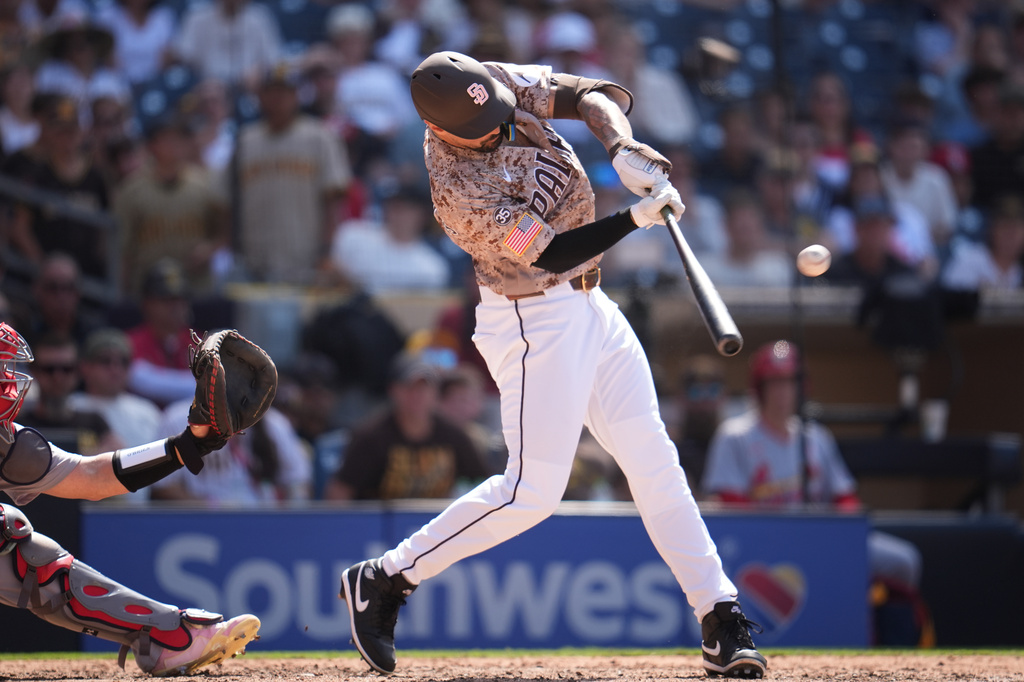 San Diego Padres' Nick Castellanos hits a two-run home run during the ninth inning of a baseball game against the St. Louis Cardinals Sunday, May 10, 2026, in San Diego. (AP Photo/Gregory Bull)