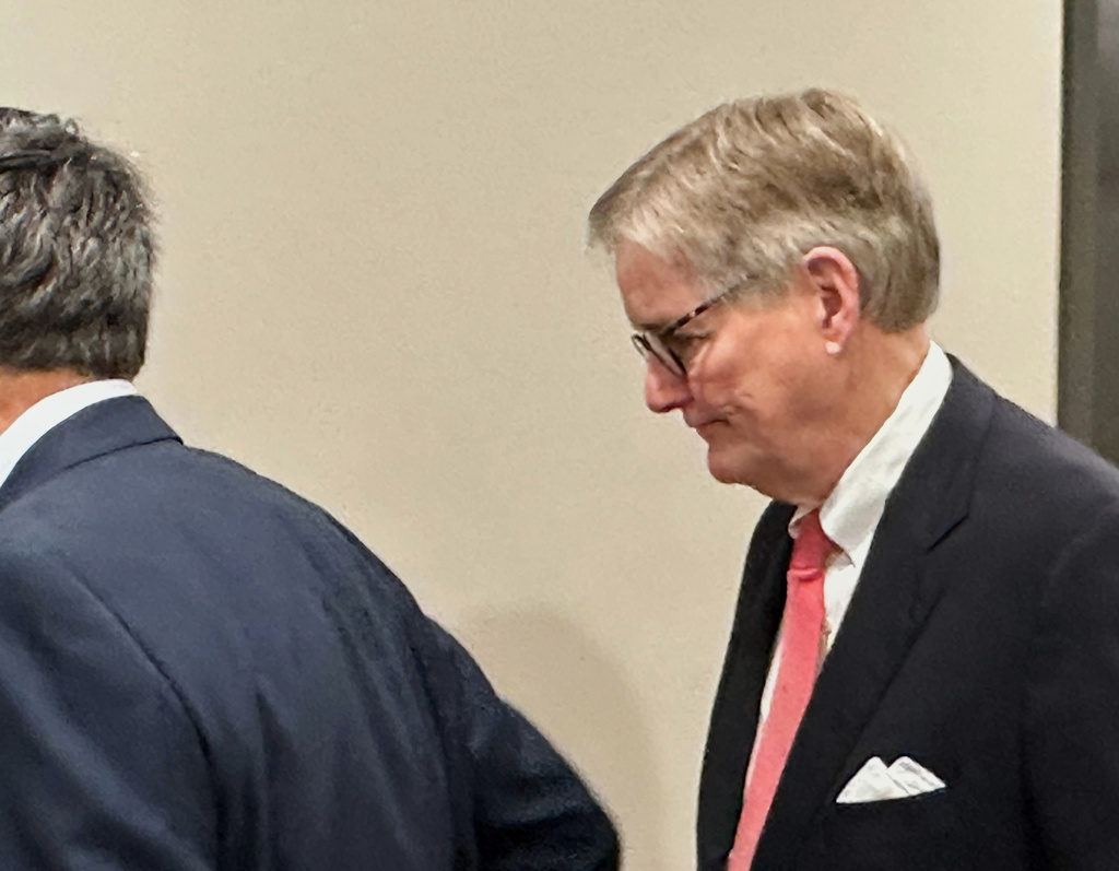 Brant Frost IV, who led failed First Liberty Building and Loan, waits for an elevator, Dec. 22, 2025, in Atlanta. (AP Photo/Jeff Amy)