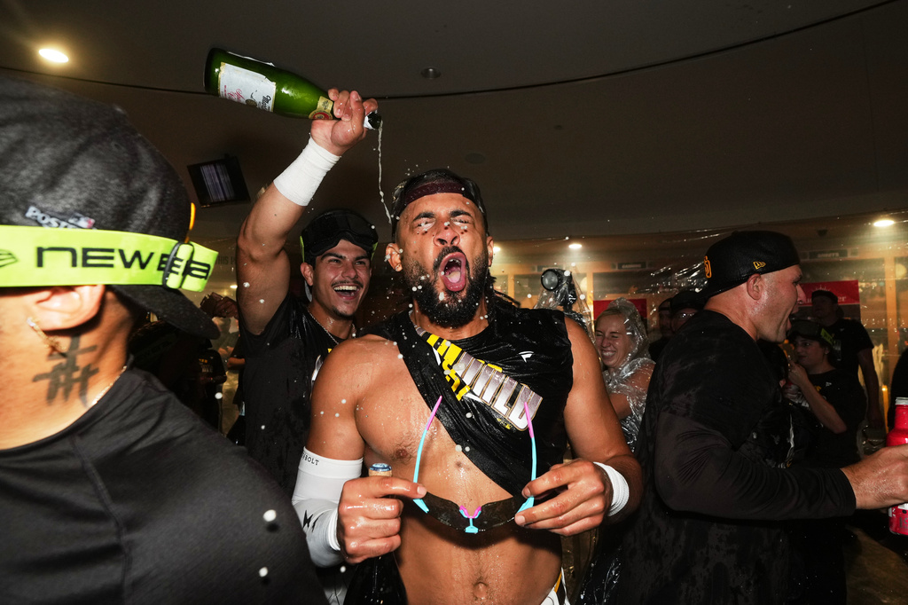 San Diego Padres right fielder Fernando Tatis Jr. celebrates with teammates after defeating the Chicago Cubs in Game 2 of the National League Wild Card baseball playoff series Wednesday, Sept. 30, 2026, in San Diego. (AP Photo/Gregory Bull)