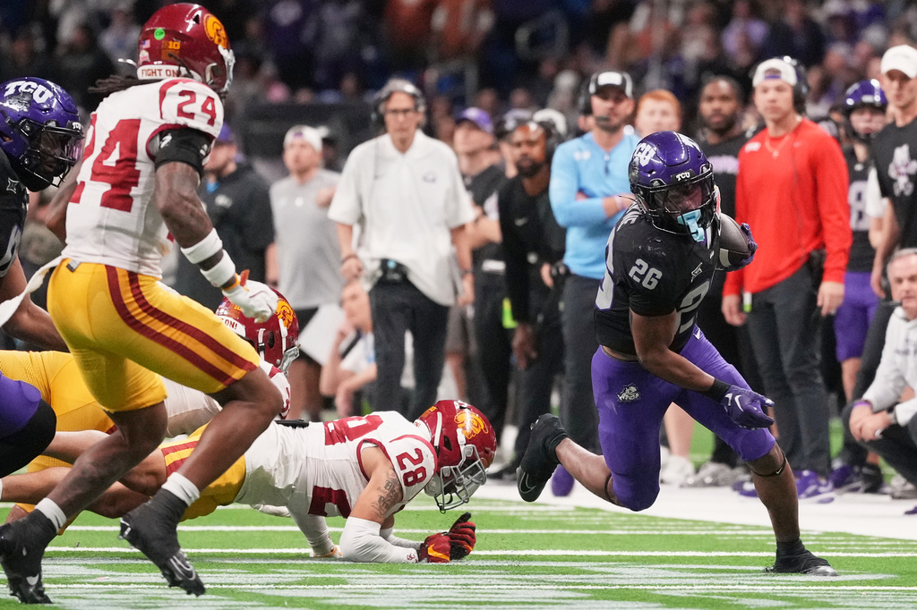 FILE - TCU running back Jeremy Payne (26) runs for a touchdown against Southern California during overtime in the Alamo Bowl NCAA college football game in San Antonio, Dec. 30, 2025. (AP Photo/Eric Gay, File)
