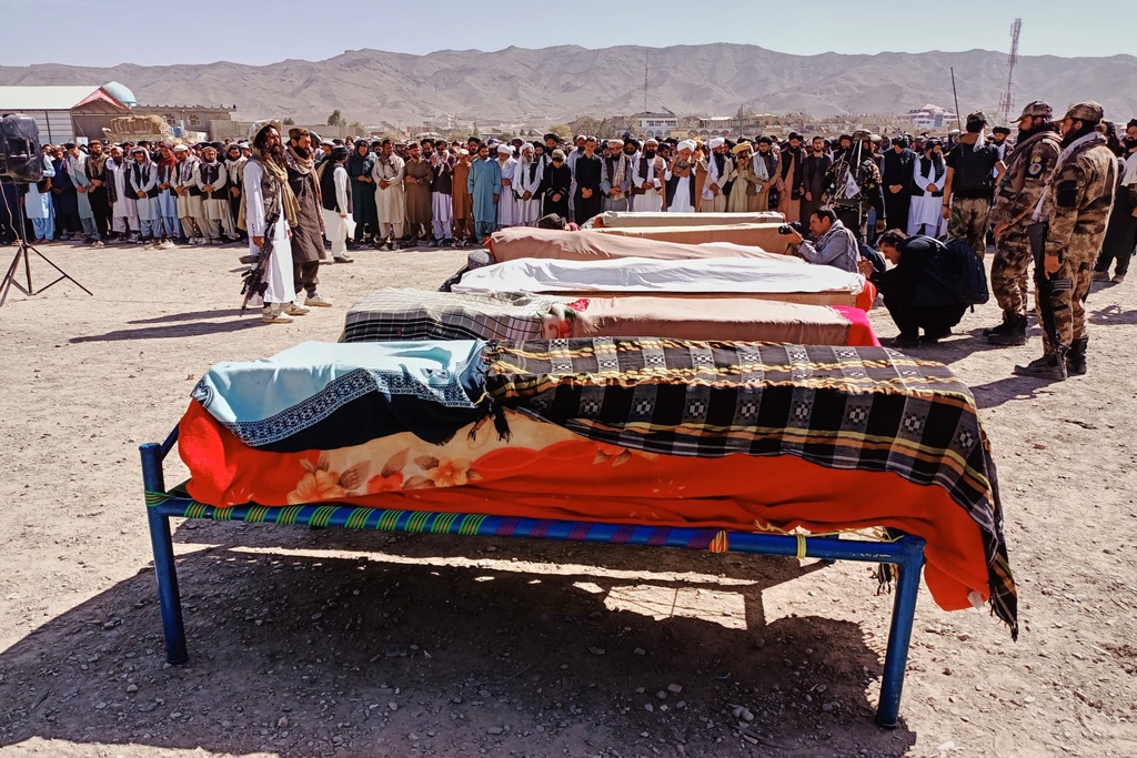 The bodies of victims of a Pakistani cross-border airstrike, including three local cricketers, are prepared for their funeral in the village of Khandaro in the Argun district of Afghanistan's eastern Paktika province, Saturday, Oct. 18, 2025. (AP Photo/Shafiqullah Mashaal)