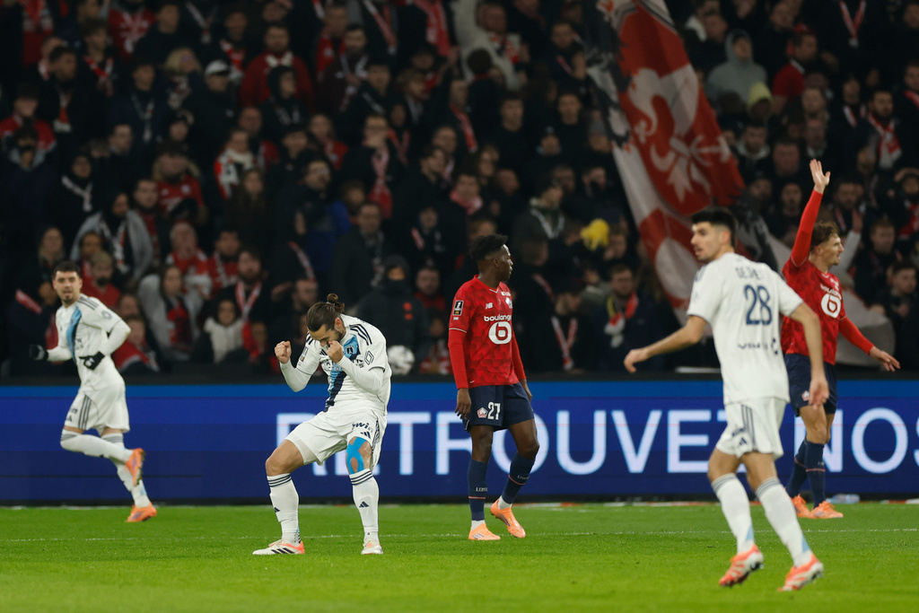 Paris FC's Marchetti Vincent, second left, celebrates the opening goal during the French League One soccer match between Lille and Paris FC in Lille, France, Sunday Nov. 23, 2025. (AP Photo/Jean-Francois Badias)