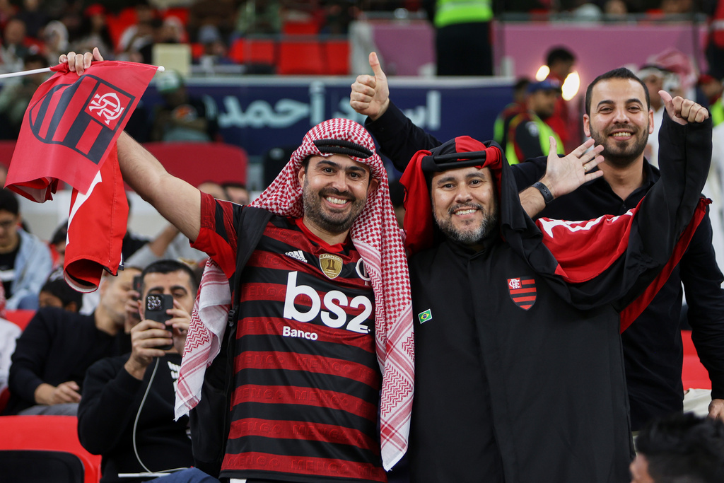 Flamengo fans pose for a photograph prior to the start of the FIFA Intercontinental Cup final soccer match between Flamengo and Paris Saint-Germain in Doha, Qatar, Wednesday, Dec. 17, 2025. (AP Photo/Hussein Sayed)