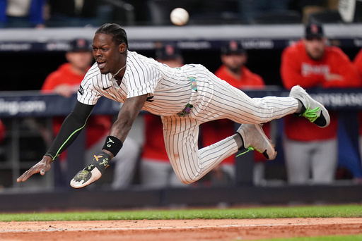 New York Yankees Jazz Chisholm Jr. dives into home plate to score on a hit by Austin Wells against the Boston Red Sox during the eighth inning of Game 2 of an American League wild-card baseball playoff series, Wednesday, Oct. 1, 2025, in New York. (AP Photo/Frank Franklin II) New York Yankees Jazz Chisholm Jr. dives into home plate to score on a hit by Austin Wells against the Boston Red Sox during the eighth inning of Game 2 of an American League wild-card baseball playoff series, Wednesday, Oct. 1, 2025, in New York. (AP Photo/Frank Franklin II)