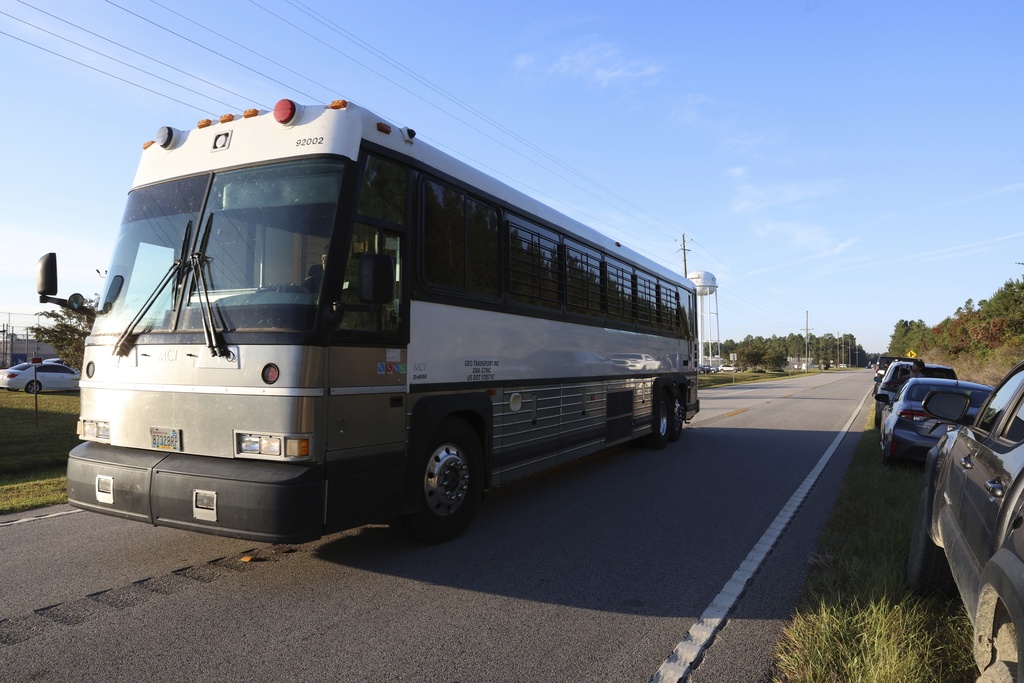 A bus leaves the Folkston Immigration and Customs Enforcement processing center, Wednesday, Sept. 10, 2025, in Folkston, Ga. (AP Photo/Gary McCullough)