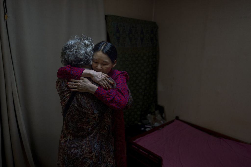 FILE - Yooree Kim, right, who was 11 when she was adopted from South Korea to a couple in France, hugs her biological mother, who had come to visit her in Seoul, South Korea, Friday, May 24, 2024. (AP Photo/Jae C. Hong, File)