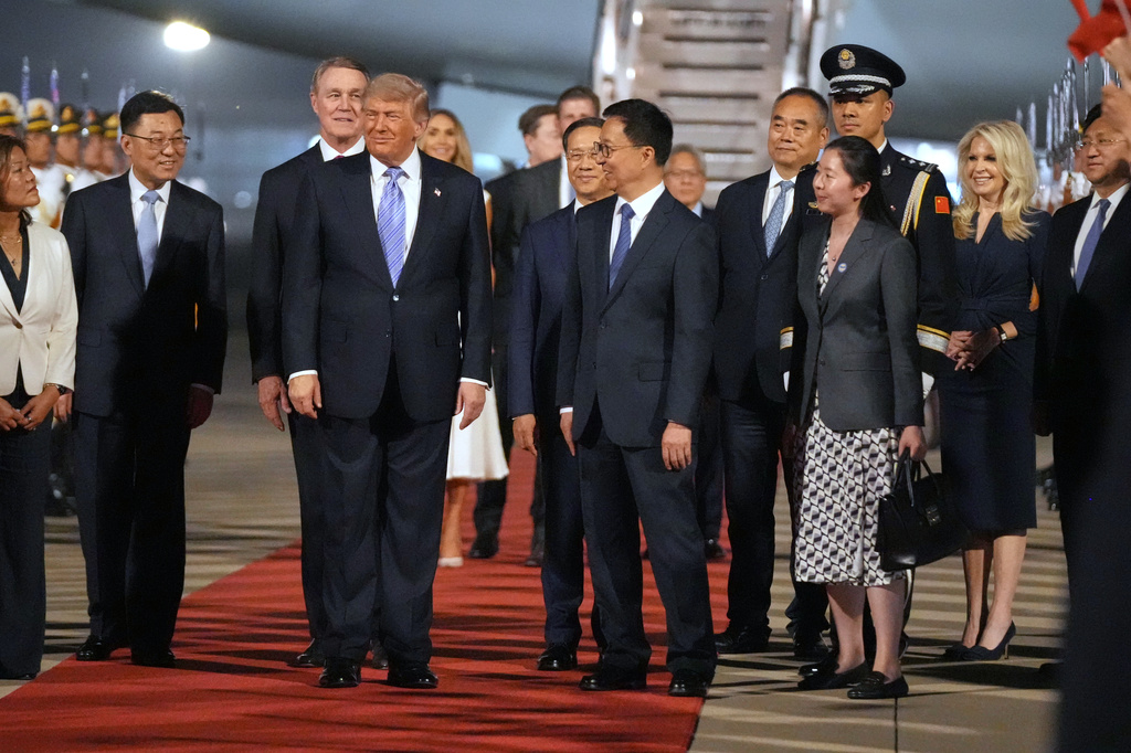 President Donald Trump pauses during a welcome ceremony as he arrives on Air Force One, Wednesday, May 13, 2026, at Beijing Capital International Airport in Beijing. (AP Photo/Mark Schiefelbein)