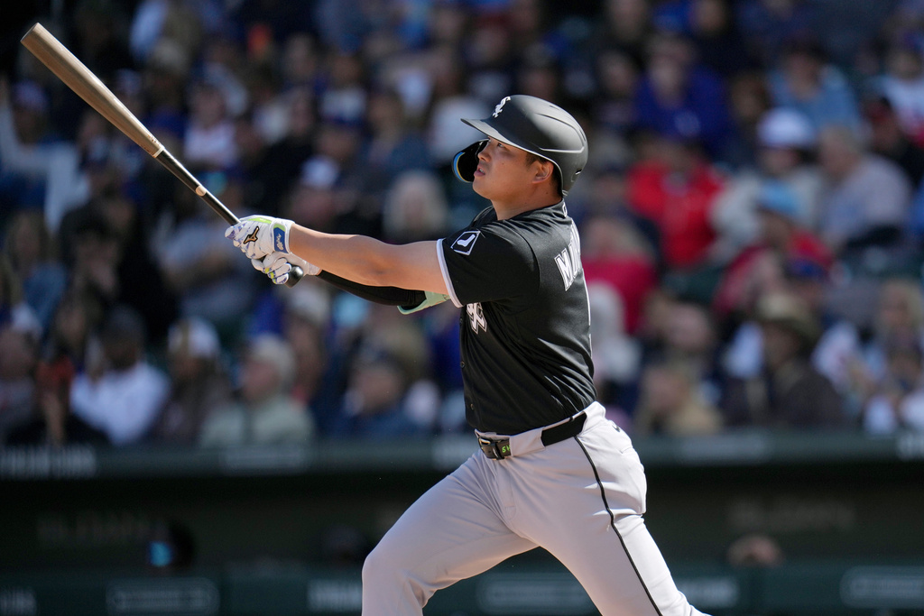 Chicago White Sox's Munetaka Murakami, of Japan, watches the flight of his two-run double against the Chicago Cubs during the fourth inning of a spring training baseball game Friday, Feb. 20, 2026, in Mesa, Ariz. (AP Photo/Ross D. Franklin)