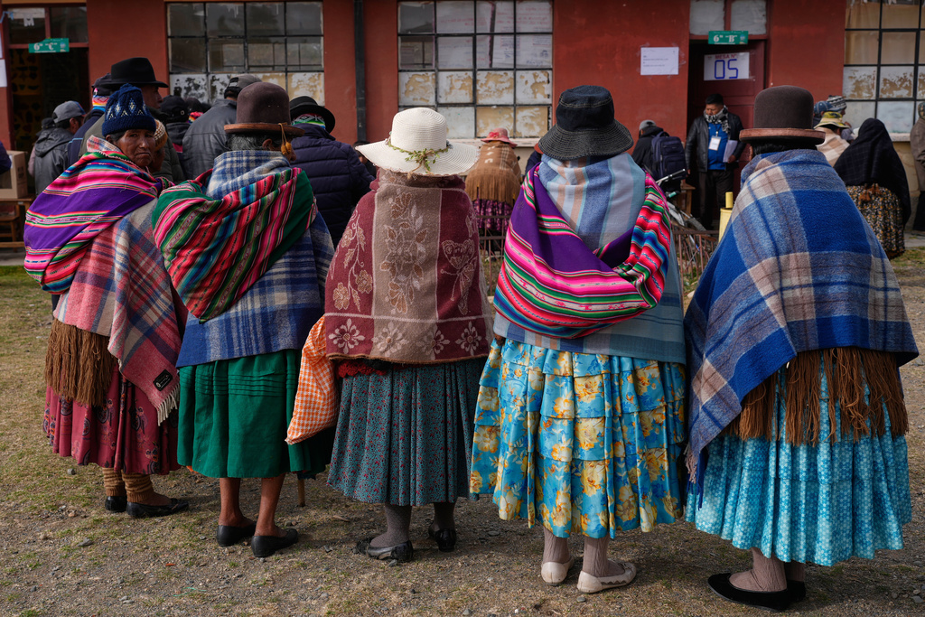 Voters line up at a polling station during a presidential runoff election in Warisata, Bolivia, Sunday, Oct. 19, 2025. (AP Photo/Juan Karita)