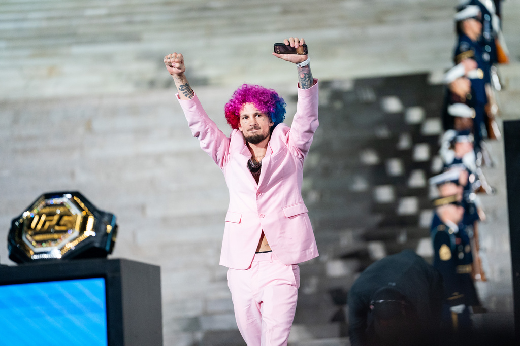 UFC bantamweight fighter Sean O'Malley enters a UFC news conference at the Lincoln Memorial, ahead of Sunday's fight on the South Lawn of the White House, Friday, June 12, 2026, in Washington. (AP Photo/Allison Robbert)