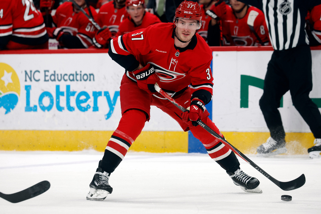 Carolina Hurricanes' Andrei Svechnikov (37) controls the puck against the Florida Panthers during the second period of an NHL hockey game in Raleigh, N.C., Friday, Jan. 16, 2026. (AP Photo/Karl DeBlaker)