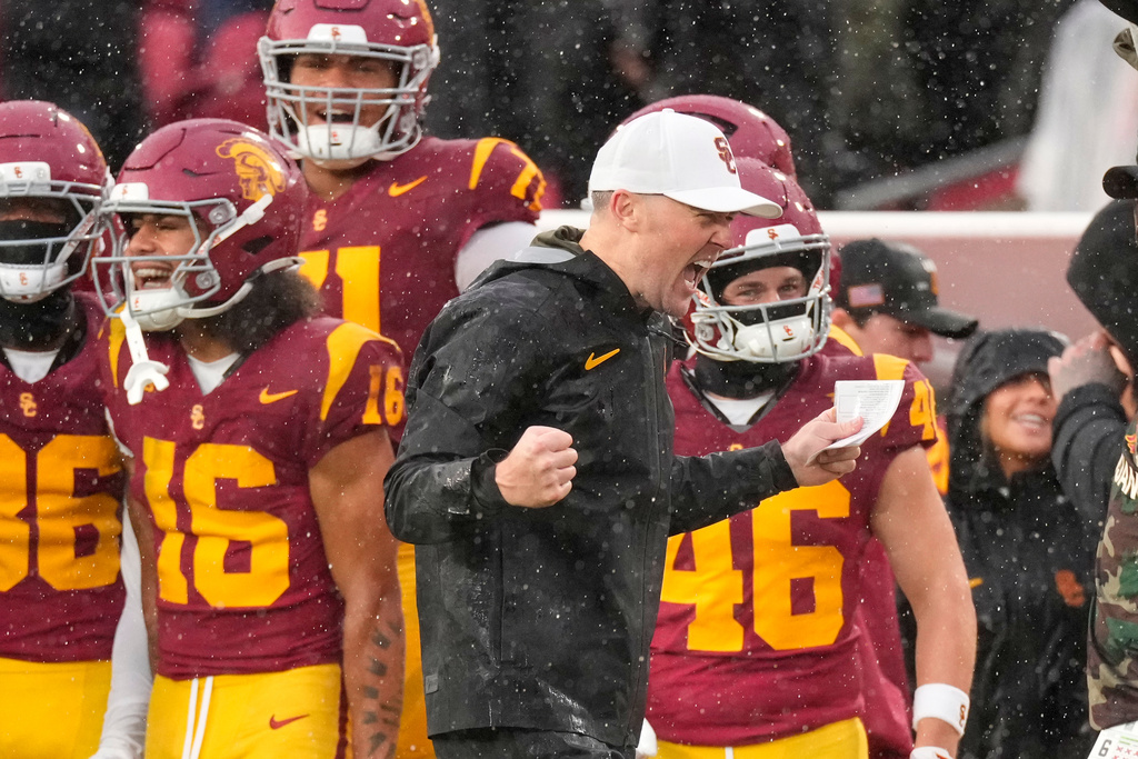 Southern California head coach Lincoln Riley celebrates as USC defeats Iowa in an NCAA college football game, Saturday, Nov. 15, 2025, in Los Angeles. (AP Photo/Mark J. Terrill)