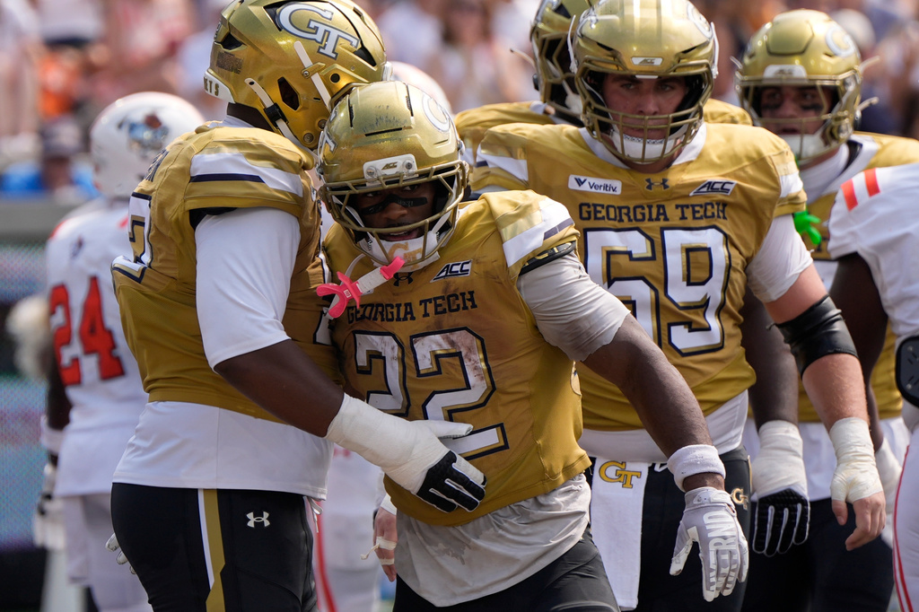 Georgia Tech running back Justice Haynes (22) celebrates his touchdown against Mercer in the first half of an NCAA college football game, Saturday, Sept. 19, 2026, in Atlanta. (AP Photo/Mike Stewart)