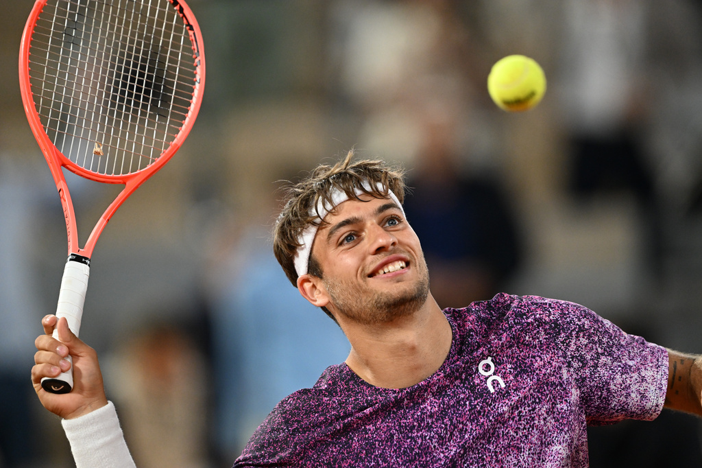 Italy's Flavio Cobolli reacts after winning the quarterfinal tennis match against Canada's Felix Auger-Aliassime at the French Open in Paris, Wednesday, June 3, 2026. (AP Photo/Emma Da Silva)