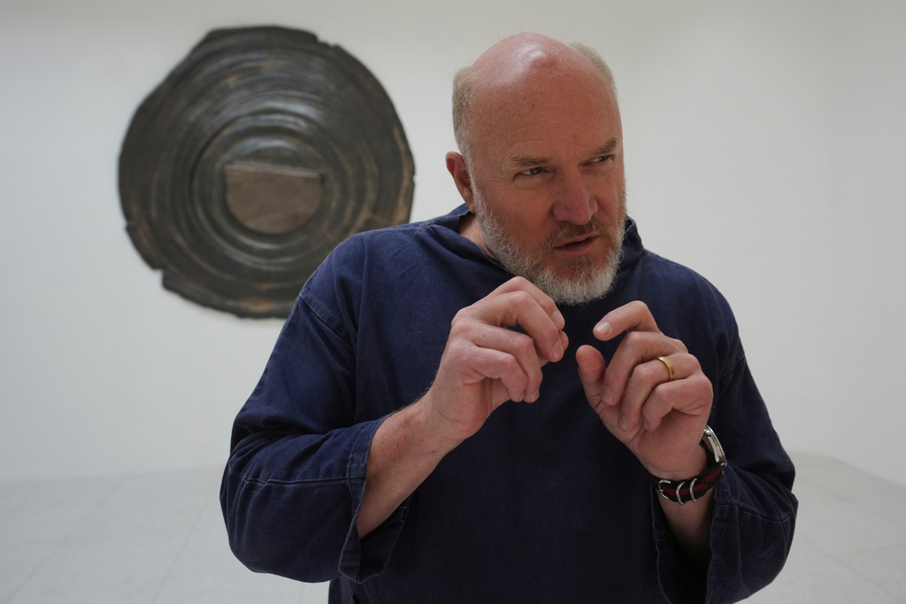 Artist Alma Allen gestures as he speaks with the Associated Press inside the United States pavilion 'Call Me the Breeze' at the Venice 2026 Biennale Art, in Venice, Italy, Tuesday, May 5, 2026. (AP Photo/Luca Bruno)