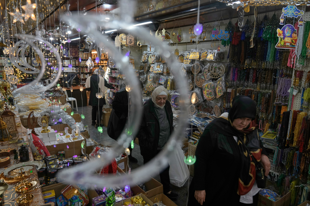 People shop for decorations in preparation for the upcoming Muslim holy month of Ramadan at a store in Beirut, Lebanon, Monday, Feb. 16, 2026. (AP Photo/Bilal Hussein)