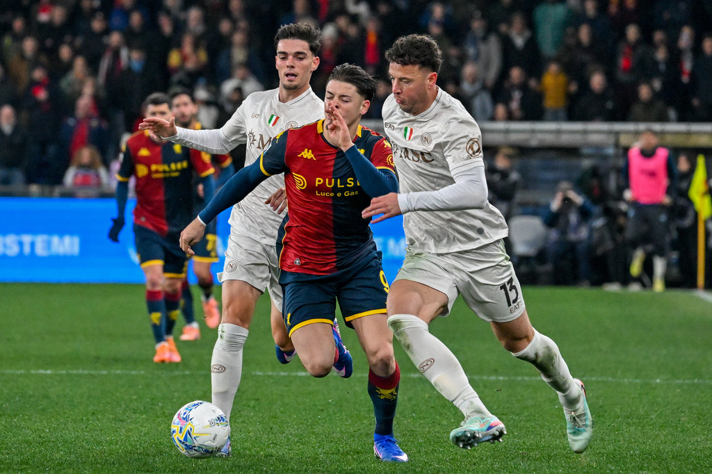 Genoa's Vitinha fights for the ball with Napoli's Amir Rrahmani, right, during the Serie A soccer match between Genoa and Napoli, Saturday, Feb. 7, 2026, in Genoa, Italy. (Tano Pecoraro/LaPresse via AP)