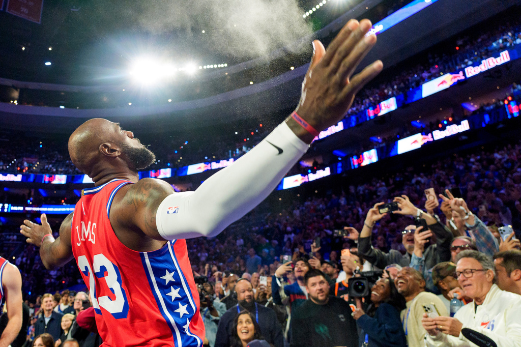 Philadelphia 76ers' LeBron James (23) does his chalk toss prior to an NBA Cup basketball game against the New York Knicks, Friday, Oct. 30, 2026, in Philadelphia. (AP Photo/Chris Szagola)