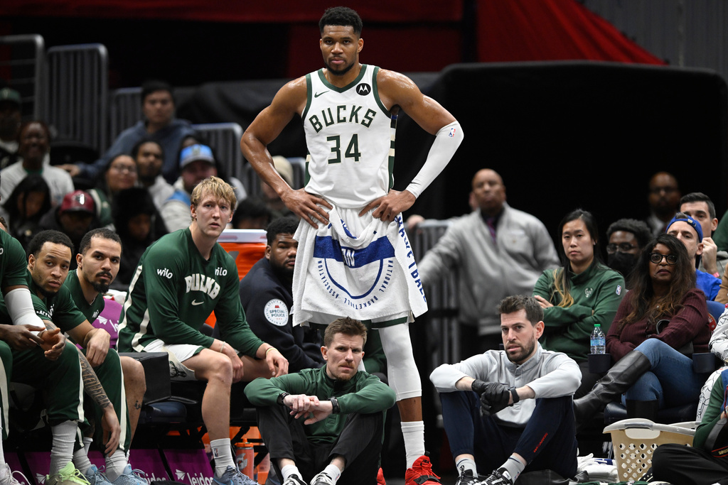 Milwaukee Bucks forward Giannis Antetokounmpo (34) watches the action while resting during the second half of an NBA basketball game against the Washington Wizards, Monday, Dec. 1, 2025, in Washington. (AP Photo/John McDonnell)