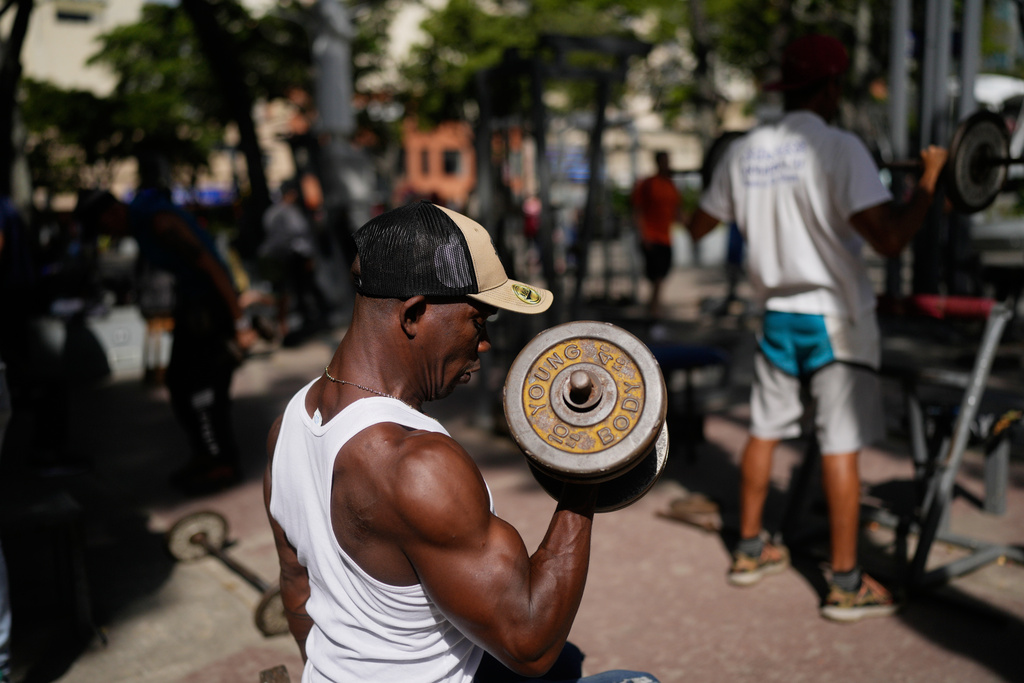 A man works out at a public park in the La Candelaria neighborhood of Caracas, Venezuela, Tuesday, Jan. 6, 2026. (AP Photo/Matias Delacroix)