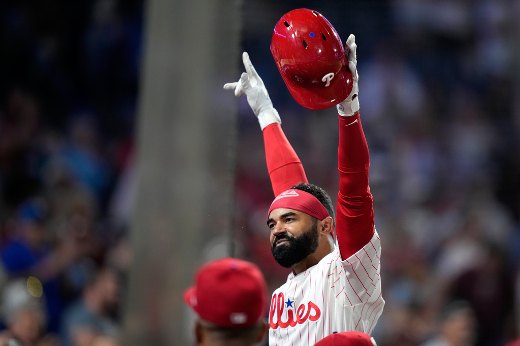Philadelphia Phillies' Derek Hill reacts after hitting a grand slam against Washington Nationals pitcher Tom Cosgrove during the seventh inning of a baseball game Monday, Aug. 3, 2026, in Philadelphia. (AP Photo/Matt Slocum)