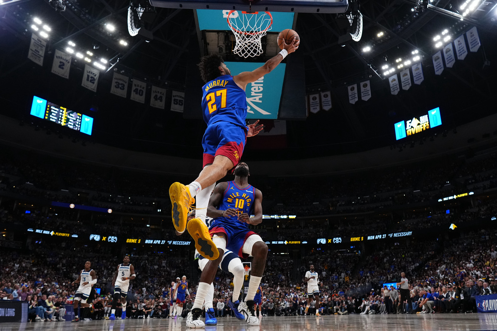 Denver Nuggets guard Jamal Murray (27) goes up for a shot against the Minnesota Timberwolves during the second half in Game 2 of a first-round NBA playoffs basketball series Monday, April 20, 2026, in Denver. (AP Photo/Jack Dempsey)
