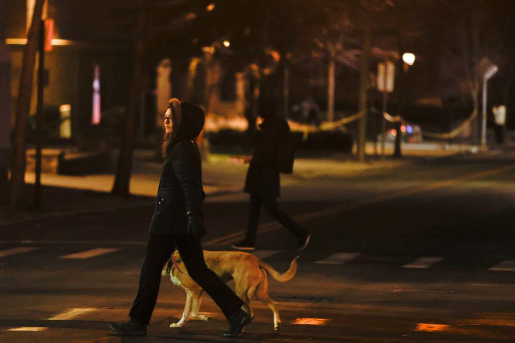 Pedestrians walk at the intersection of Waterman St. and Brook St. in Providence, R.I., Wednesday, Dec. 17, 2025. (Lily Speredelozzi/The Sun Chronicle via AP)