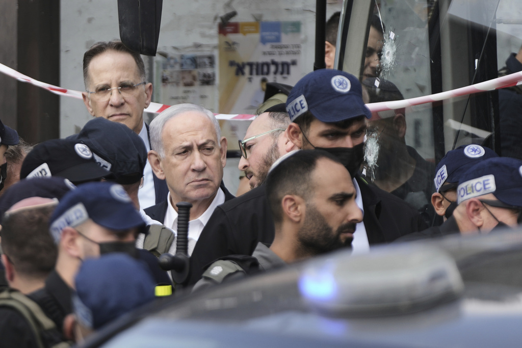 Israeli Prime Minister Benjamin Netanyahu visits the site of a shooting attack carried out by two Palestinian gunmen, in which several people were killed and others injured at a bus stop in Jerusalem, Monday, Sept. 8, 2025. (AP Photo/Mahmoud Illean)